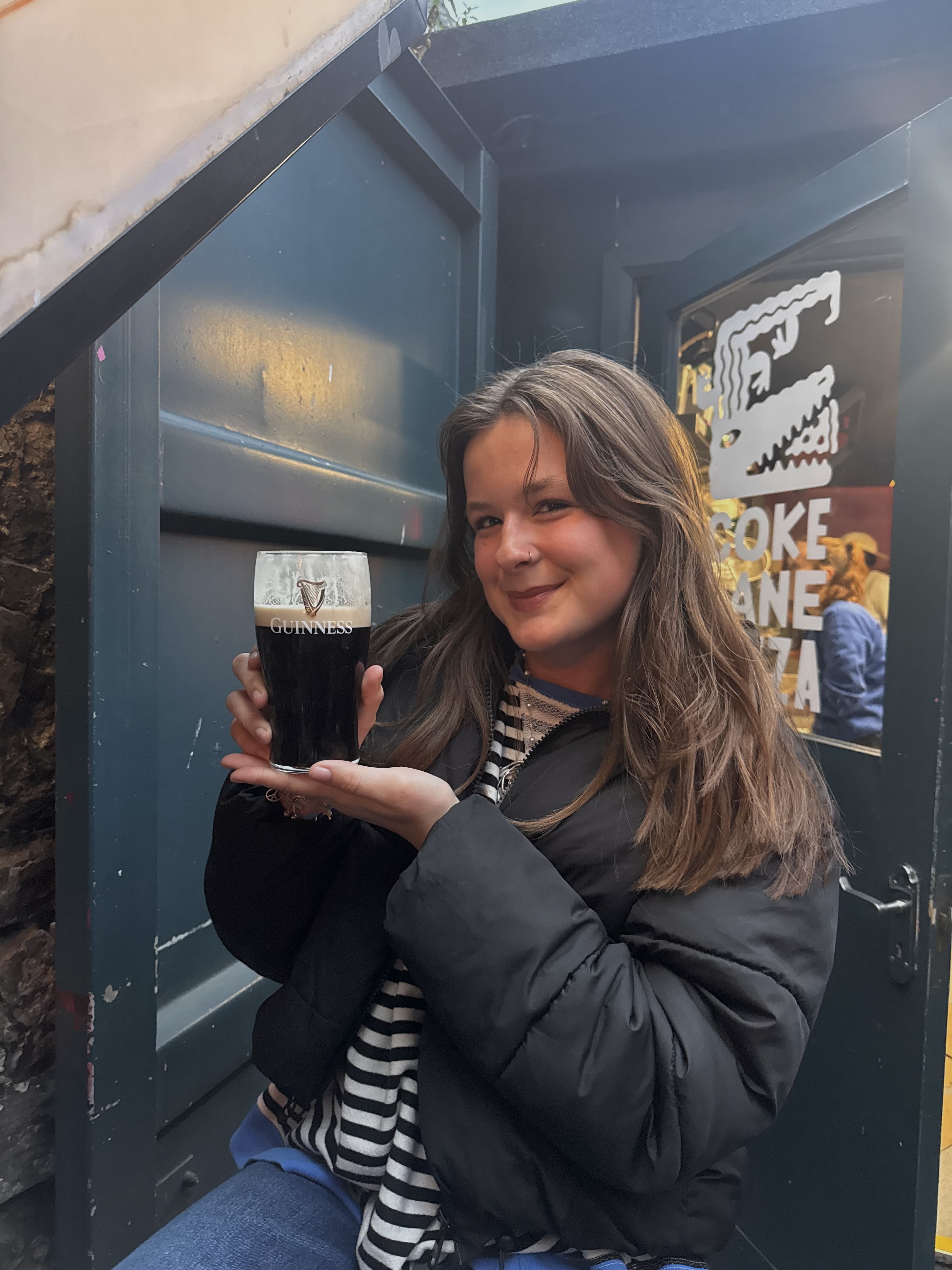 Mia holding a guinness