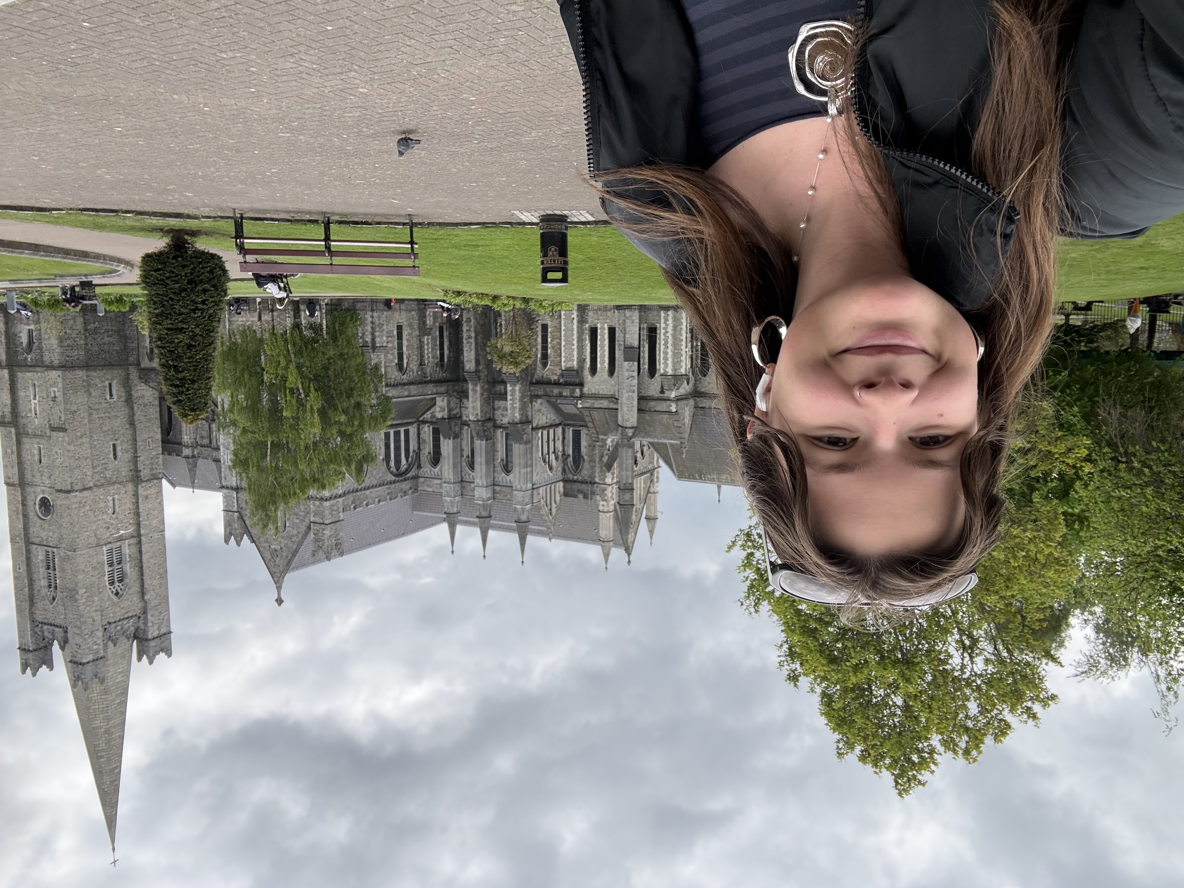 Mia in front of a grey cathedral