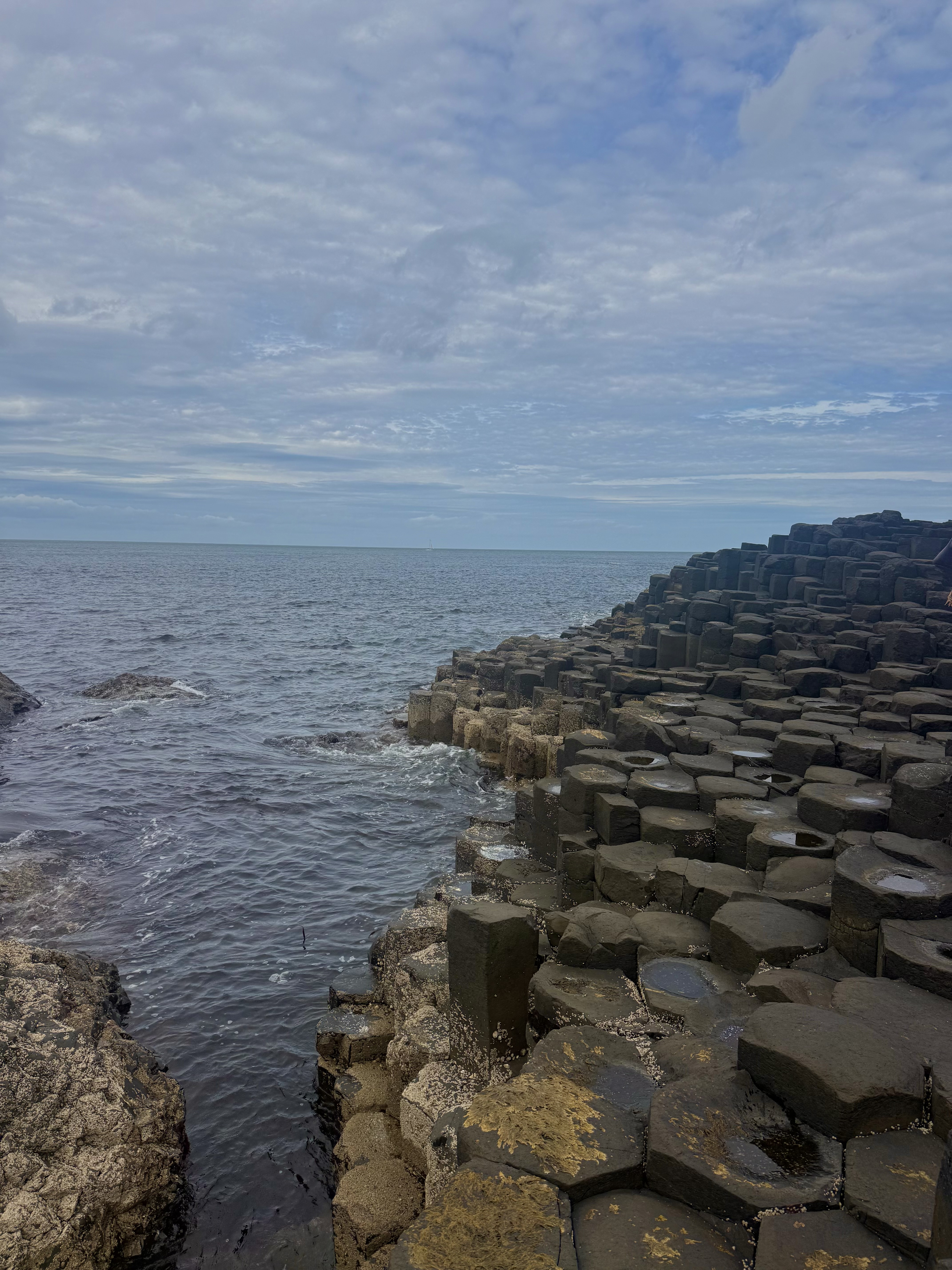 hexagon shaped stones along the ocean